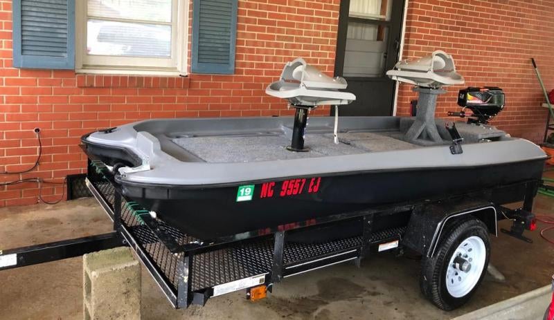 10ft pond prowler with outboard and trailer